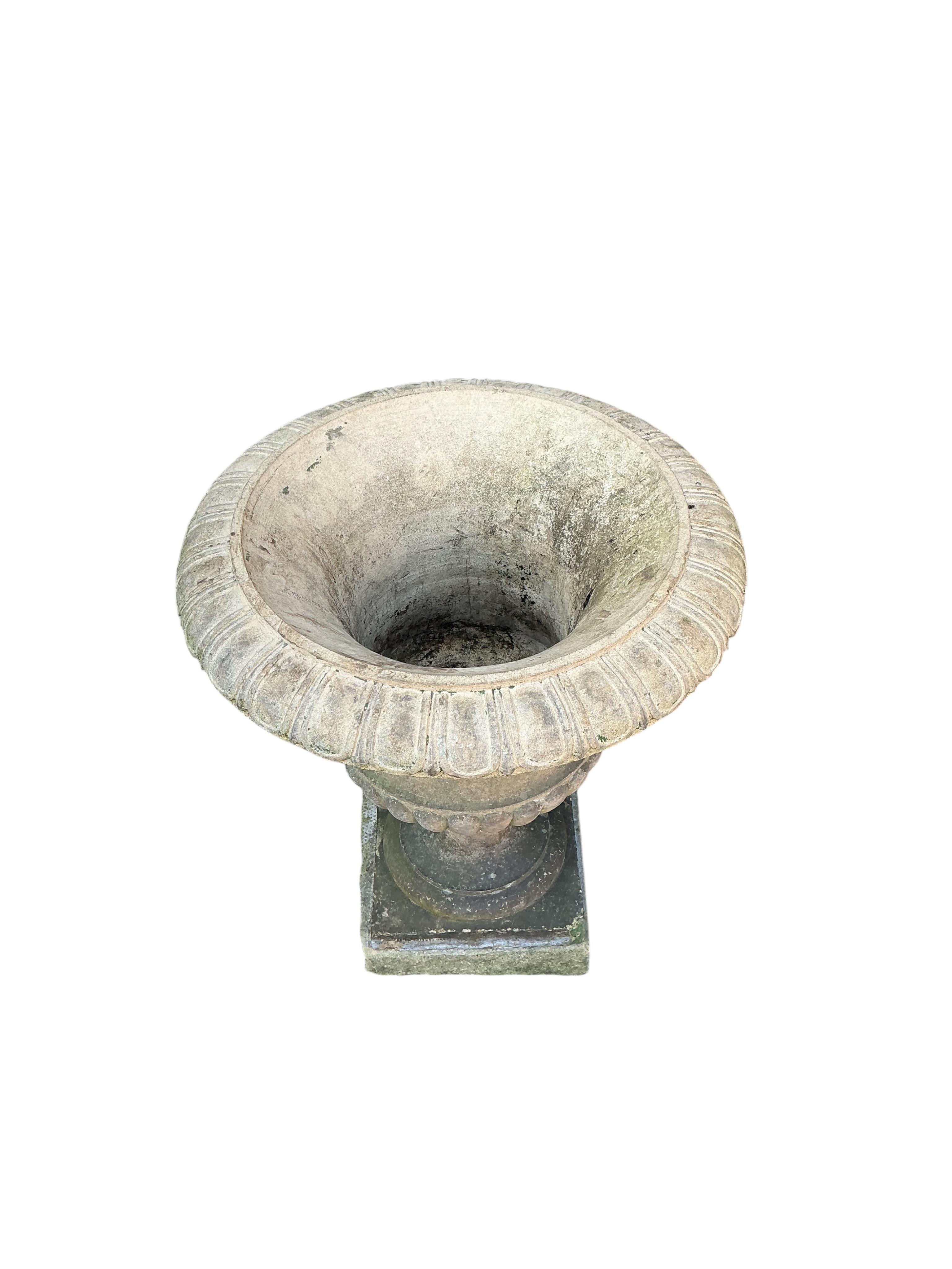 A Victorian Blashfield buff terracotta campana shaped garden urn, stamped ‘Blashfield, Stamford 1870’, diameter 46cm, height 56cm